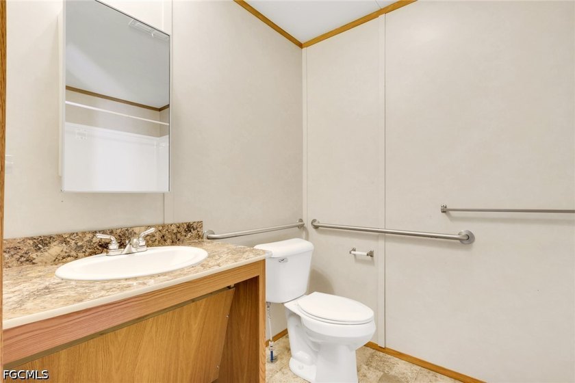 Situated on over half an acre, this pristine three-bedroom - photo 8
