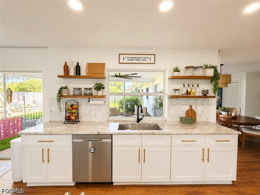 Welcome to this beautifully updated 4BR, 2BA with 2 car garage - photo 4