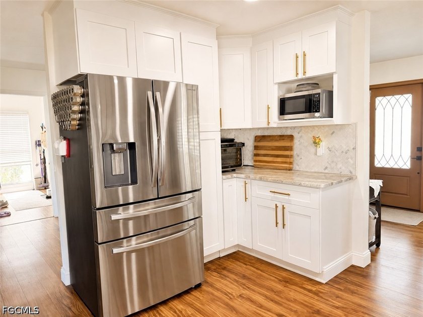 Welcome to this beautifully updated 4BR, 2BA with 2 car garage - photo 5