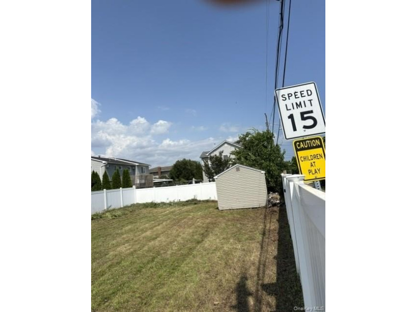 This compact, fully fenced lot offers a secure and practical - photo 3