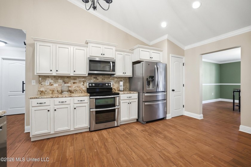 Step into this beautifully renovated home where modern updates - photo 12