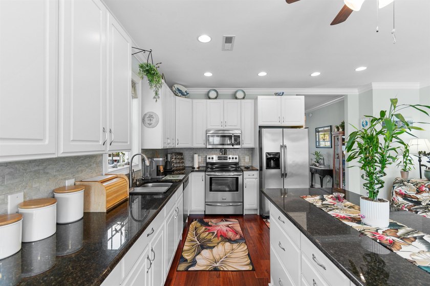 This spacious 4-bedroom, 3-bath home offers a versatile open - photo 14
