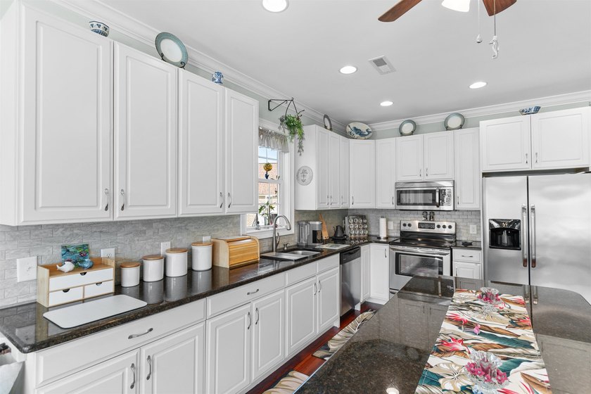 This spacious 4-bedroom, 3-bath home offers a versatile open - photo 15