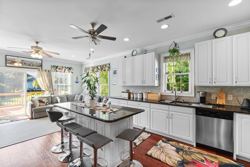 This spacious 4-bedroom, 3-bath home offers a versatile open - photo 18