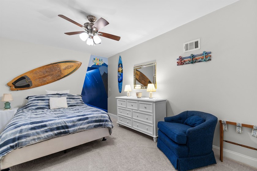 This spacious 4-bedroom, 3-bath home offers a versatile open - photo 32