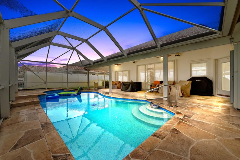 Welcome to this beautifully maintained pool &amp; lakefront home - photo 2