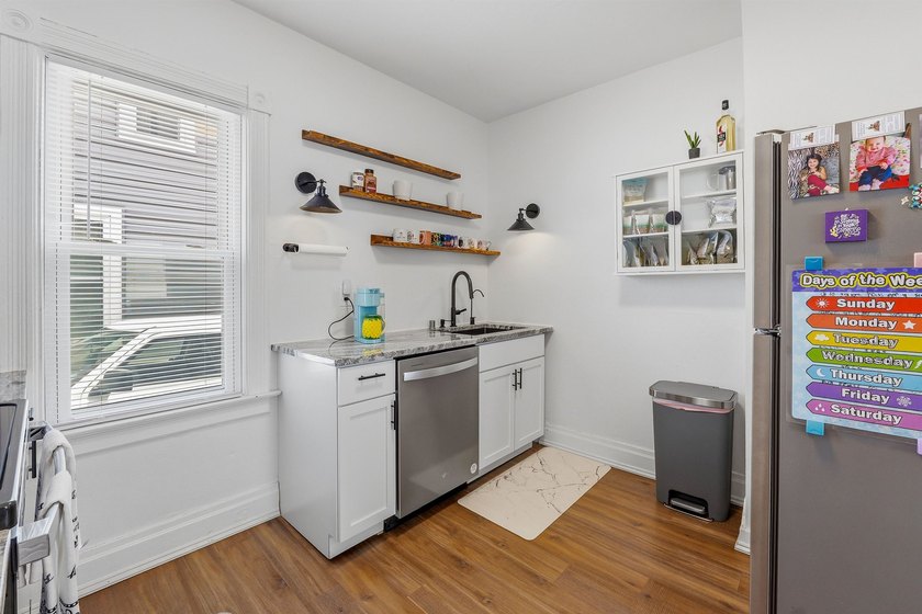 Welcome home to this charming 3-bedroom, 1.5-bath home featuring - photo 7