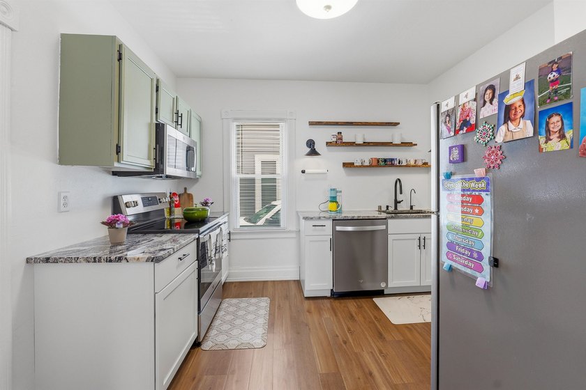 Welcome home to this charming 3-bedroom, 1.5-bath home featuring - photo 8
