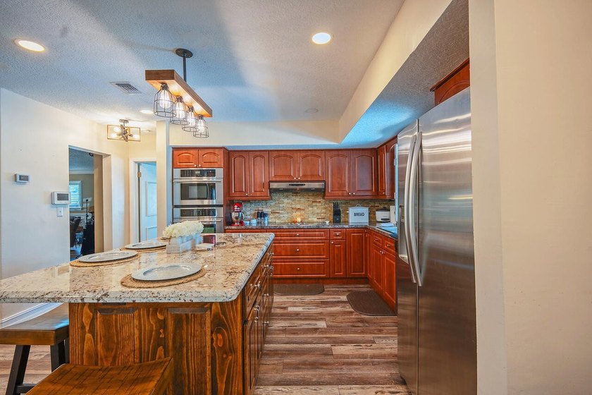 This beautifully maintained 4/2 pool home offers just under 2 - photo 2