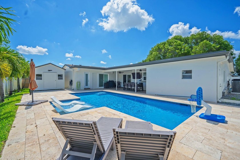 This beautifully maintained 4/2 pool home offers just under 2 - photo 10