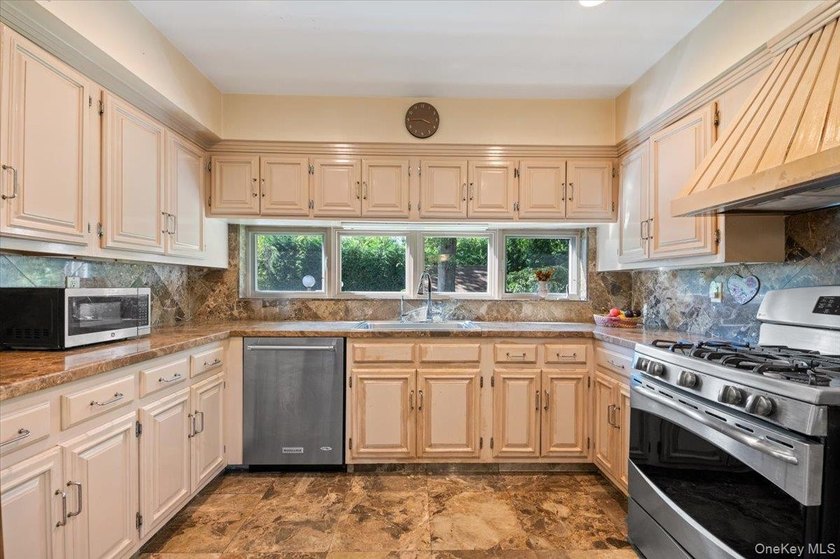 Step into this beautiful, romantic side-hall Colonial, where - photo 13
