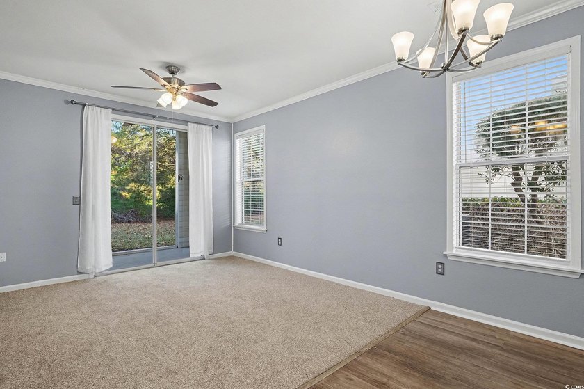 This welcoming 2-bedroom, 2-bath first-floor end-unit condo sits - photo 2