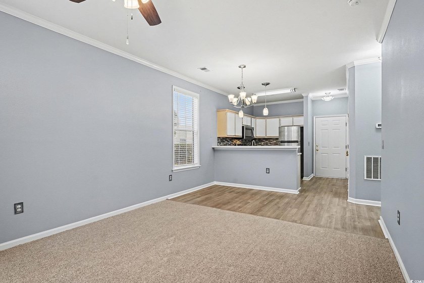 This welcoming 2-bedroom, 2-bath first-floor end-unit condo sits - photo 4