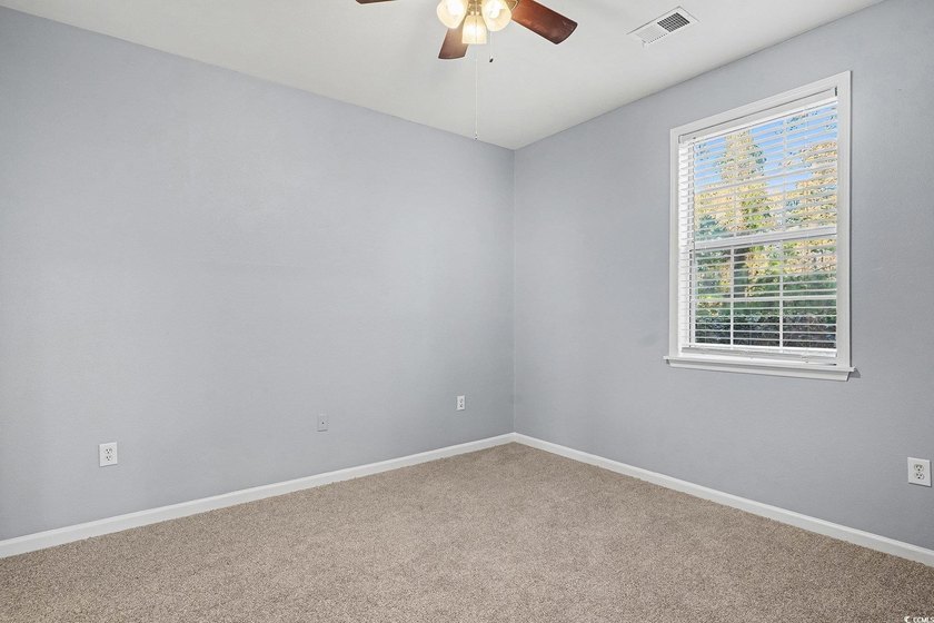 This welcoming 2-bedroom, 2-bath first-floor end-unit condo sits - photo 10