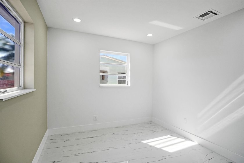 Completely renovated 4-bedroom, 3-bathroom home in desirable - photo 14