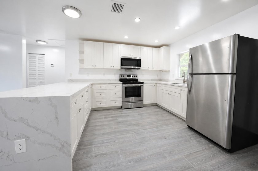 Completely renovated newer construction home featuring 3 - photo 6