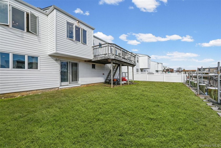 Waterfront high ranch offering 4 bedrooms and 2 full baths, set - photo 21