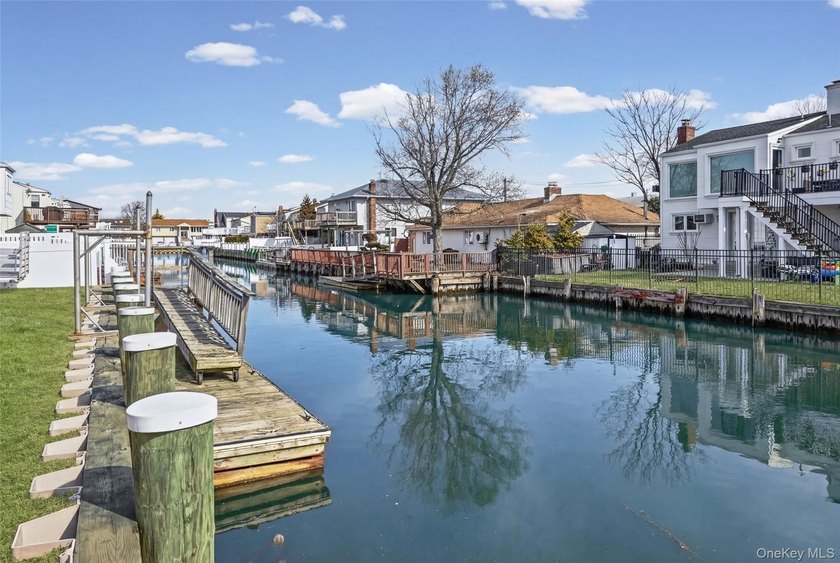 Waterfront high ranch offering 4 bedrooms and 2 full baths, set - photo 25