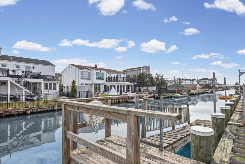 Waterfront high ranch offering 4 bedrooms and 2 full baths, set - photo 26