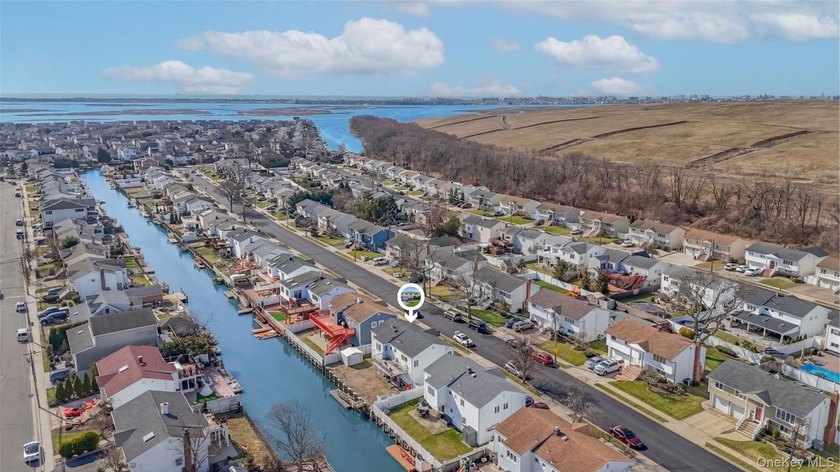 Waterfront high ranch offering 4 bedrooms and 2 full baths, set - photo 30