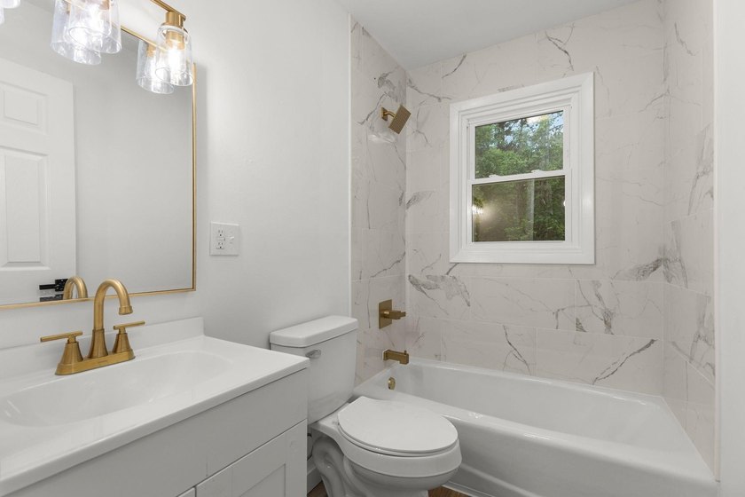 Completely updated 4-bedroom home situated on 2.9 private acres - photo 10