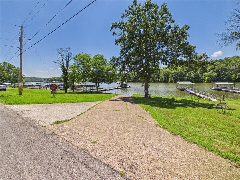 Welcome to the Lake! This home in a quiet neighborhood sits with - photo 2