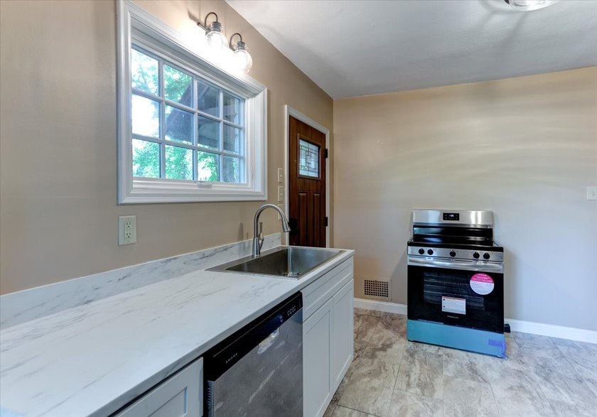 Architectural Gem with Timeless Tudor Charm! Fall in love with - photo 15