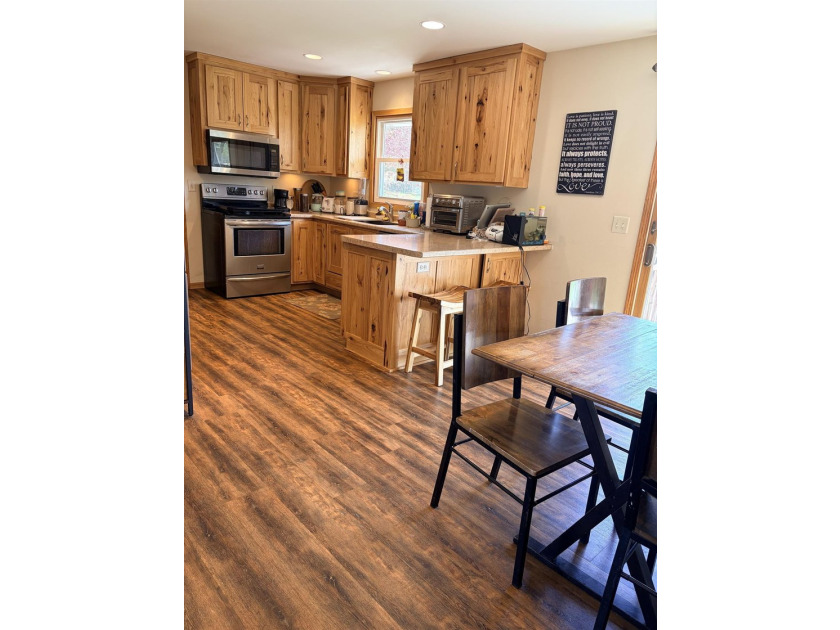 Welcome home to this conveniently updated Ranch situated on a - photo 7