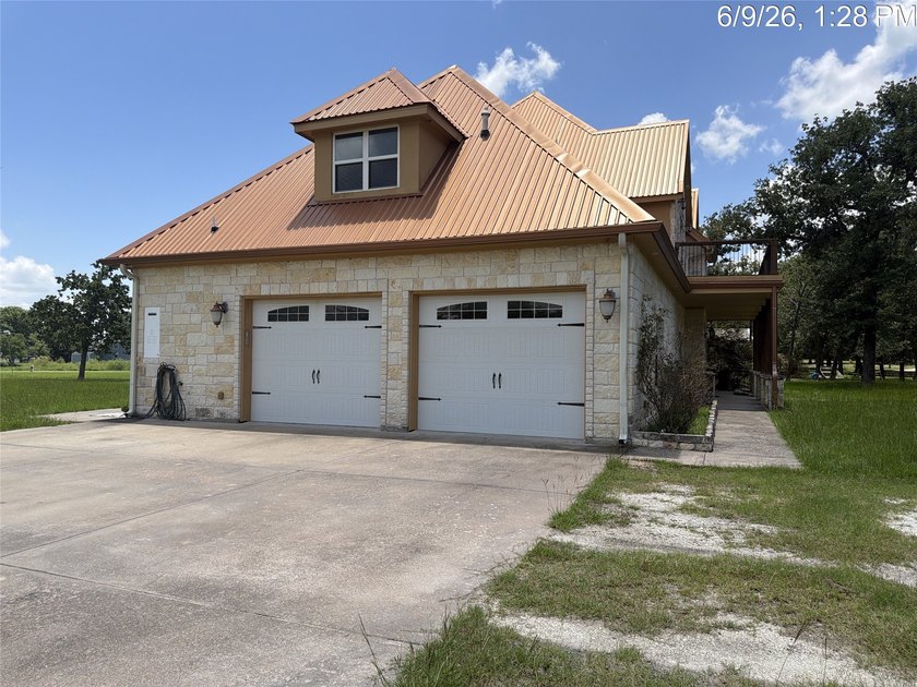 Set on 1.48 wooded acres along Lake Limestone, this custom stone - photo 2