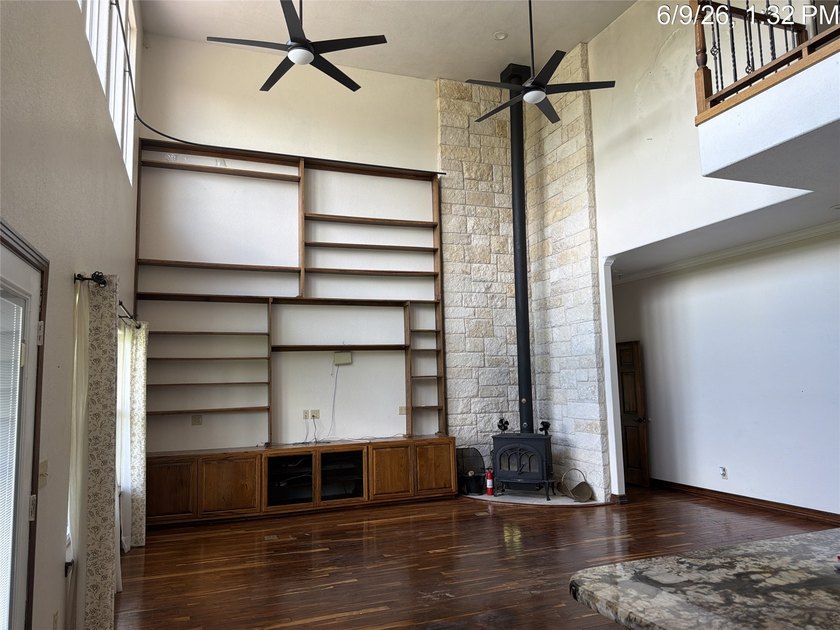 Set on 1.48 wooded acres along Lake Limestone, this custom stone - photo 7