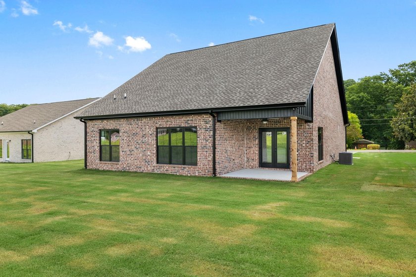 Welcome to this charming cottage-style new construction in the - photo 6