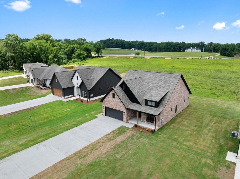 Welcome to this charming cottage-style new construction in the - photo 7