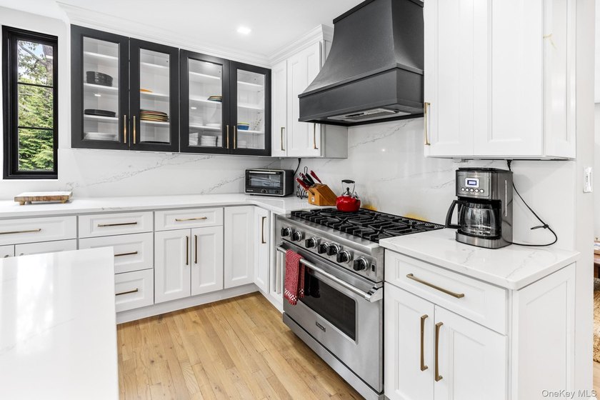 This exquisitely updated home is situated at the end of a - photo 11