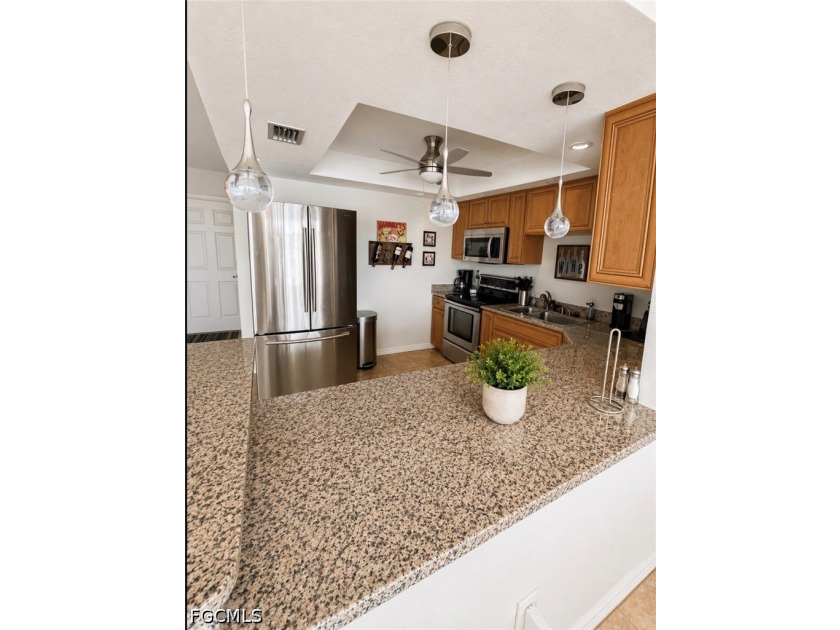 Live the Florida lifestyle in this beautifully maintained - photo 4