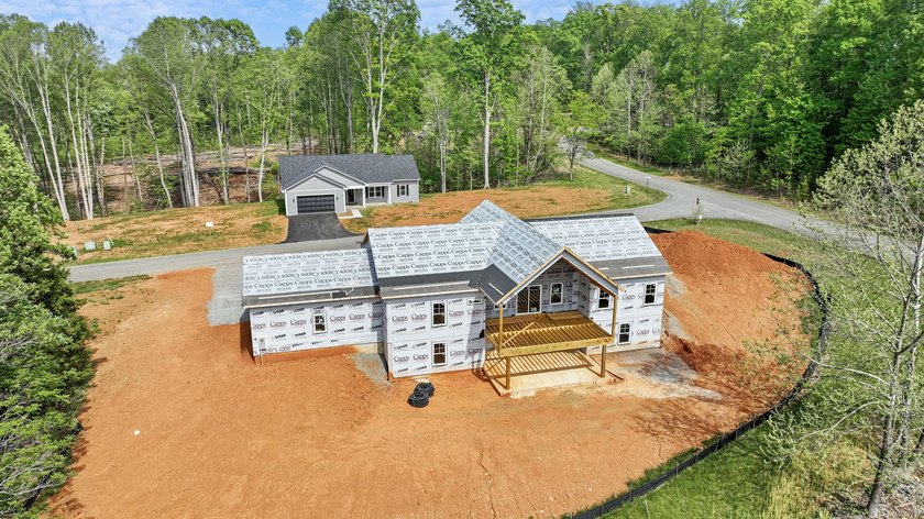 Quality new construction on a beautiful 1.7-acre corner lot! - photo 3