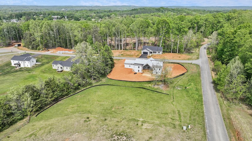 Quality new construction on a beautiful 1.7-acre corner lot! - photo 4