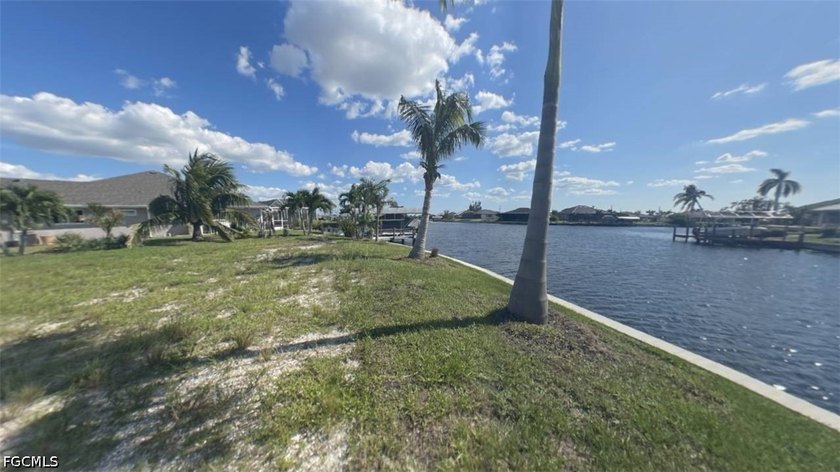 This PREMIER lot is on a HUGE intersecting canal with a - photo 3
