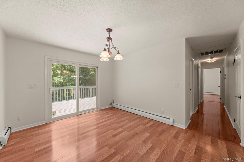Tucked away on a beautifully wooded and private lot, this - photo 8