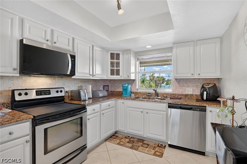 Assurant 1yr. Home Warranty Included! Some condos just feel like - photo 22