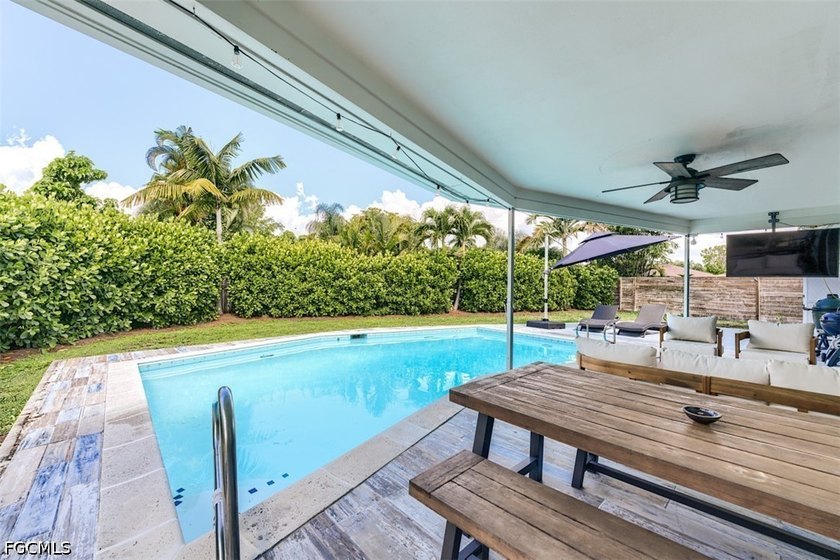 Beautifully renovated 3-bedroom, 2-bath pool home offering a - photo 3