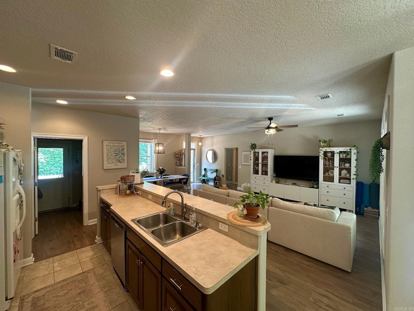 Welcome home to this inviting one-level home on the east side of - photo 3