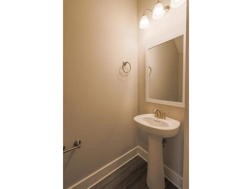 This Savannah floor plan features 3 bedrooms, 2.5 baths, and a - photo 11
