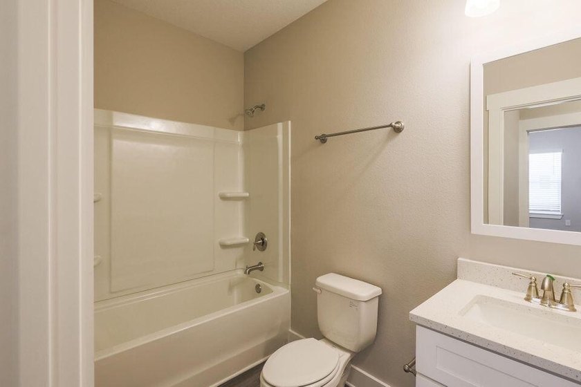 This Savannah floor plan features 3 bedrooms, 2.5 baths, and a - photo 13