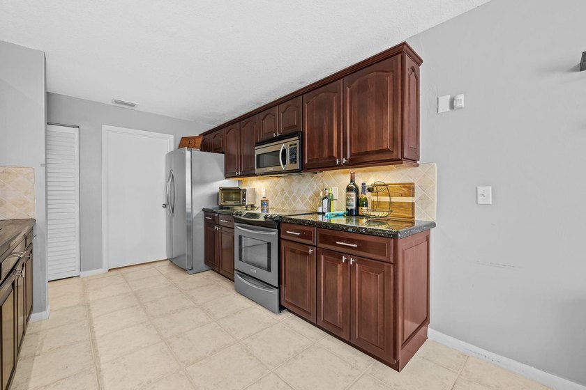 Nestled in the heart of Boca Raton, this two story townhome on a - photo 8