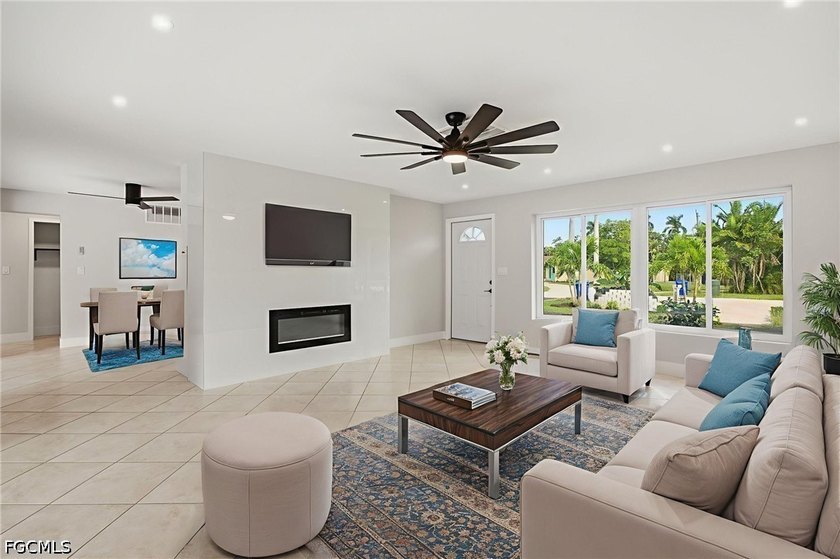 Welcome to this beautifully renovated pool home in the highly - photo 3