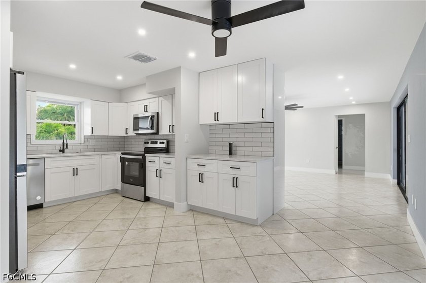Welcome to this beautifully renovated pool home in the highly - photo 4