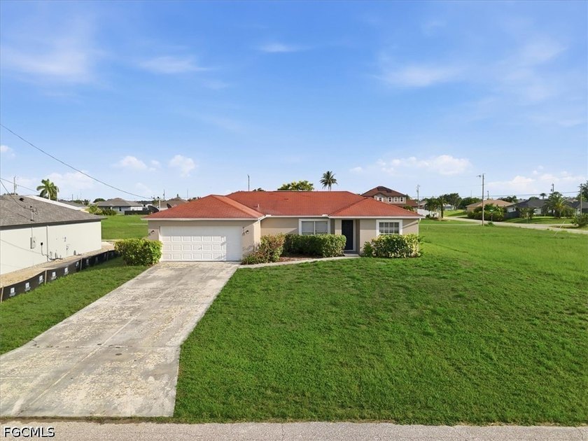 3-bedroom, 2-bath home offering an open-concept layout with tile - photo 3