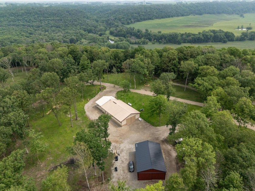 Nestled deep within 60 acres of pristine woodland just 15 - photo 2