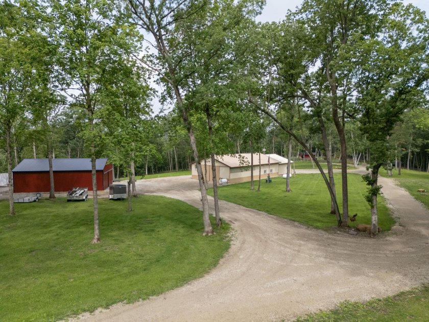 Nestled deep within 60 acres of pristine woodland just 15 - photo 3