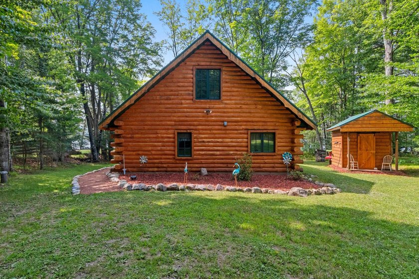 Experience true Northwoods living in this beautiful full log - photo 3